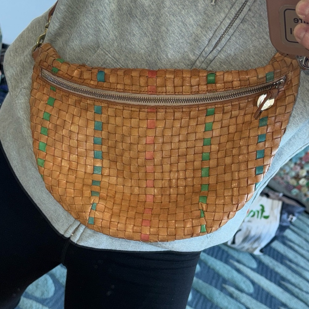 Clare V  - Grande Fanny .
Woven Tan with pink, blue and green accents.